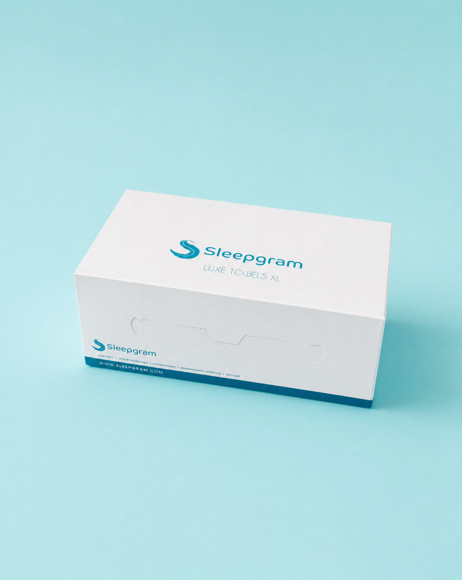 Sleepgram Luxe Towels XL box photographed on a soft turquoise studio background